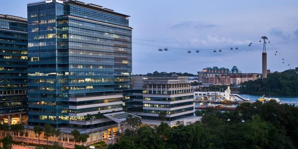 Keppel Bay Tower – Keppel Bay Tower at dusk with Sentosa cable car, HarbourFront, Singapore