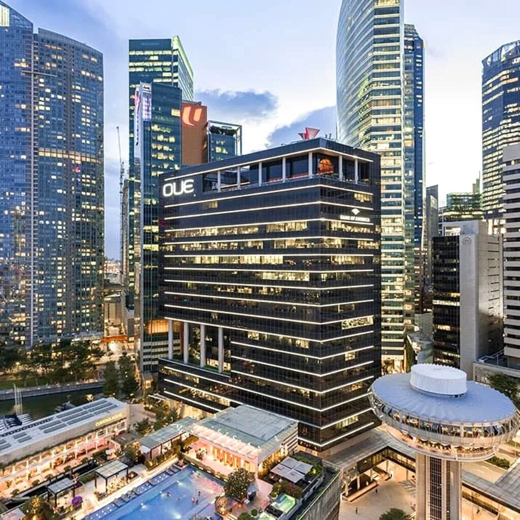 OUE Bayfront – OUE Bayfront and the Marina Bay skyline at dusk, Singapore