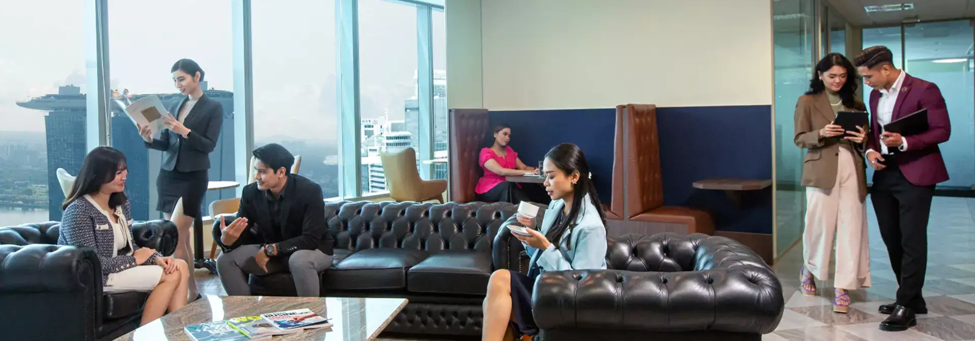 Servcorp MBFC Tower 2 office breakout lounge with Marina Bay skyline view